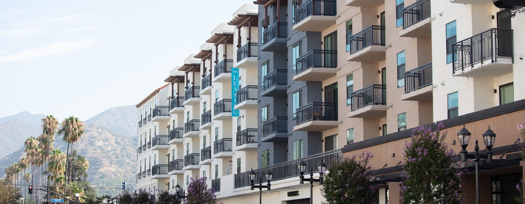 view of a building with a mountain in the background